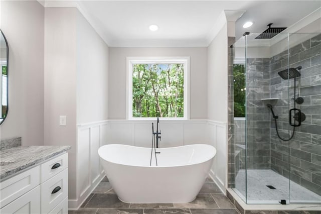 4189 Tamarack Dr, Jasper, GA 30143 - full bathroom featuring vanity, a shower stall, a freestanding tub, crown molding, and a wainscoted wall