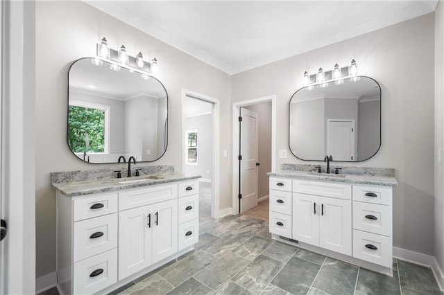 4189 Tamarack Dr, Jasper, GA 30143 - bathroom with two vanities, crown molding, and baseboards
