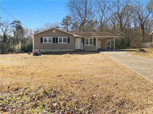 ranch-style home with a carport and a front lawn