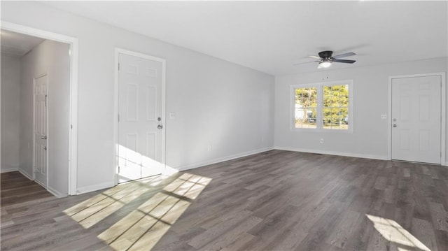 interior space featuring ceiling fan and dark hardwood / wood-style floors