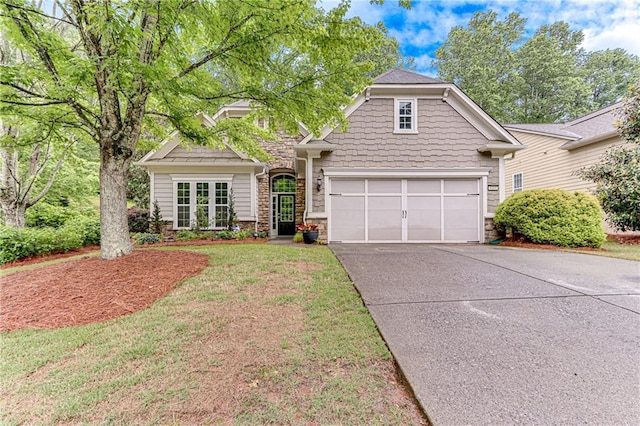 4460 Delano Dr, Cumming, GA 30040 - view of front of home with driveway, stone siding, and a garage