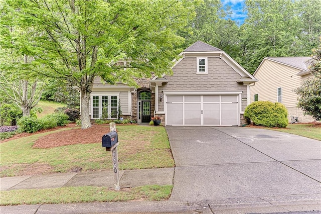4460 Delano Dr, Cumming, GA 30040 - view of front of property with concrete driveway, stone siding, a front lawn, and a garage