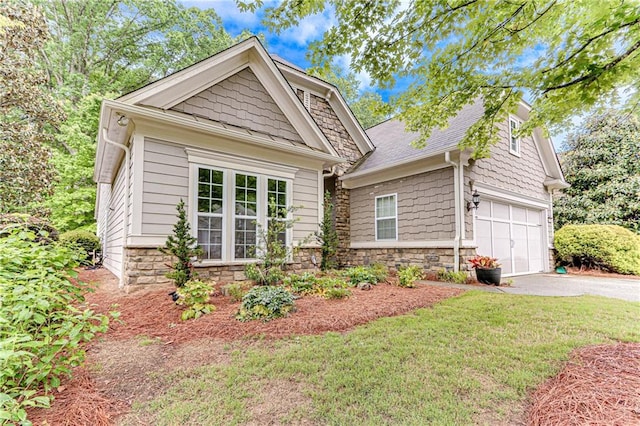 4460 Delano Dr, Cumming, GA 30040 - craftsman house featuring stone siding, asphalt driveway, a front yard, and roof with shingles