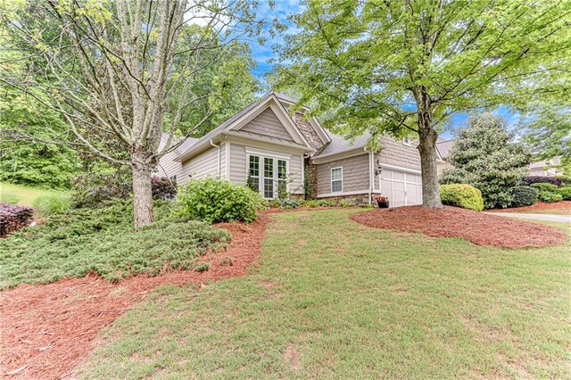 4460 Delano Dr, Cumming, GA 30040 - view of front facade featuring a front yard and driveway