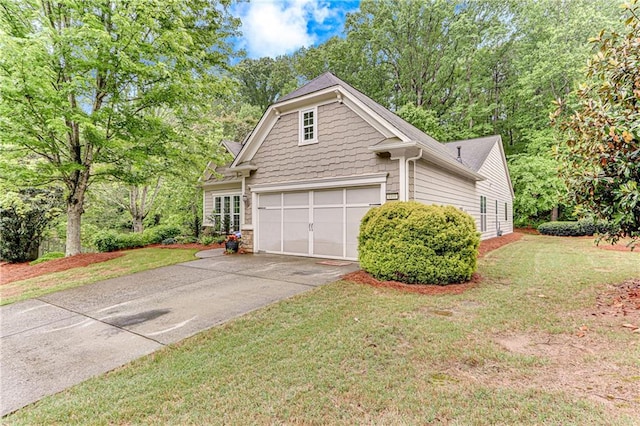 4460 Delano Dr, Cumming, GA 30040 - view of side of property with driveway, an attached garage, a yard, and stone siding