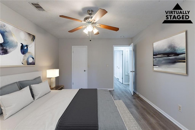 bedroom featuring hardwood / wood-style flooring and ceiling fan