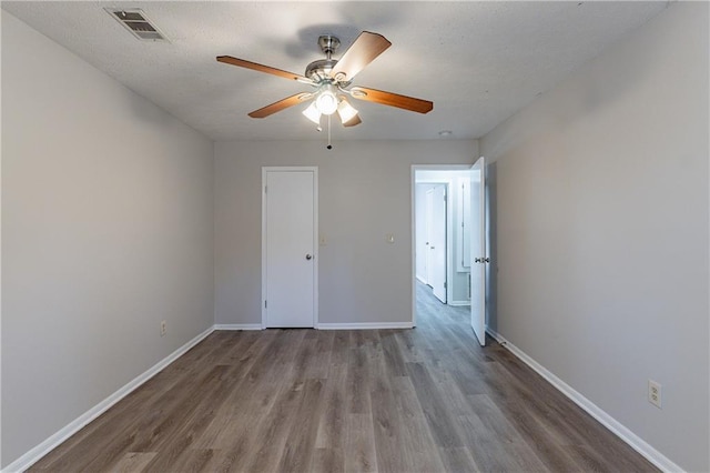 unfurnished bedroom featuring hardwood / wood-style flooring and ceiling fan