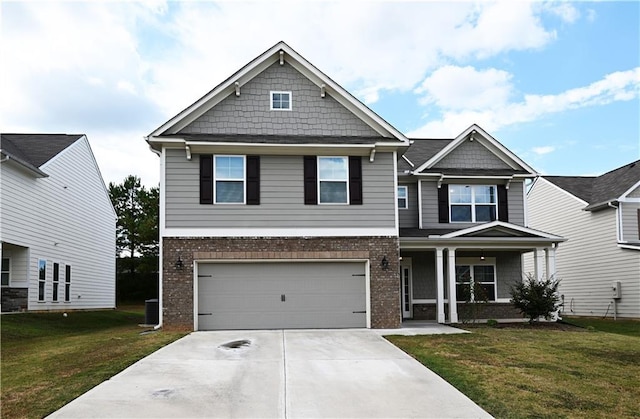 craftsman-style home with driveway, a front yard, a porch, and brick siding