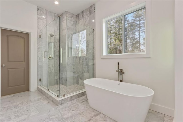 full bath with a shower stall, baseboards, a freestanding bath, recessed lighting, and marble finish floor