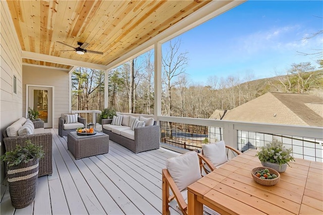 wooden deck featuring outdoor lounge area and outdoor dining area