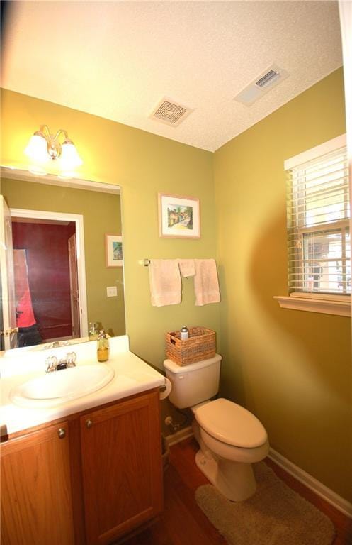 70 Darbys Crossing Ct, Hiram, GA 30141 - bathroom featuring toilet, vanity, wood finished floors, and baseboards