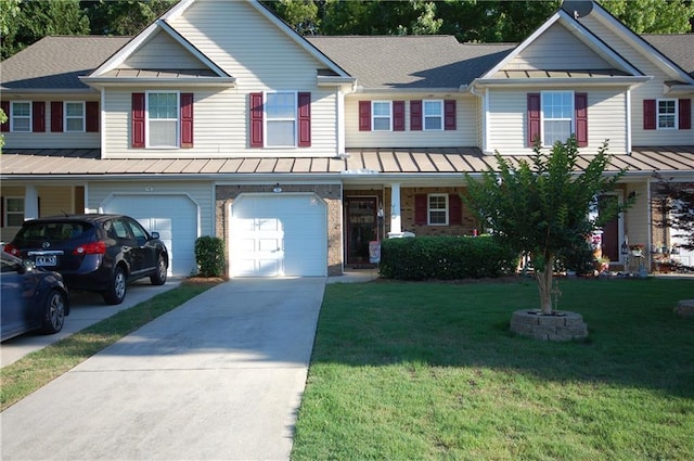 70 Darbys Crossing Ct, Hiram, GA 30141 - view of front facade with a standing seam roof, driveway, an attached garage, a front lawn, and metal roof