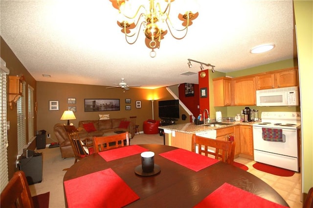 70 Darbys Crossing Ct, Hiram, GA 30141 - dining area with a chandelier, a ceiling fan, and a textured ceiling