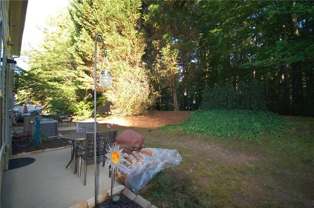 70 Darbys Crossing Ct, Hiram, GA 30141 - view of yard with a patio area, central AC, and outdoor dining space