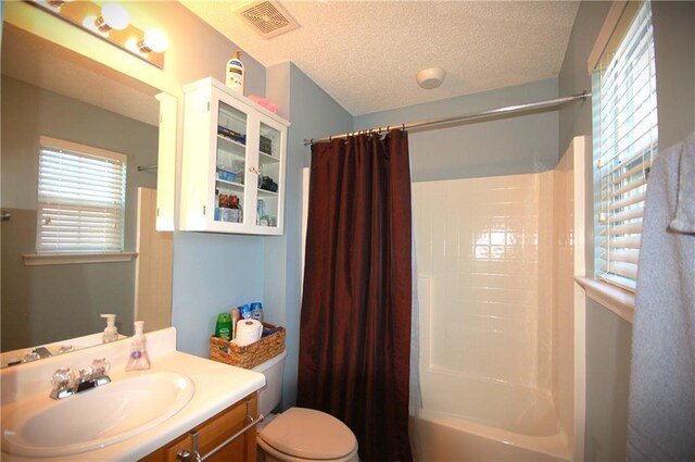 70 Darbys Crossing Ct, Hiram, GA 30141 - bathroom featuring vanity, toilet, shower / tub combo, and a textured ceiling
