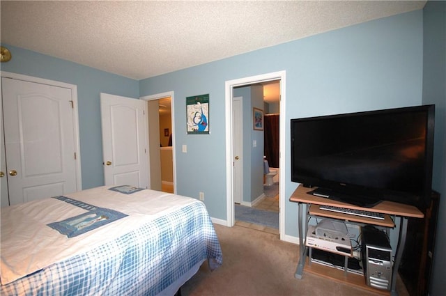 70 Darbys Crossing Ct, Hiram, GA 30141 - carpeted bedroom featuring baseboards, a textured ceiling, and connected bathroom