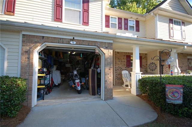 70 Darbys Crossing Ct, Hiram, GA 30141 - garage featuring a porch and concrete driveway