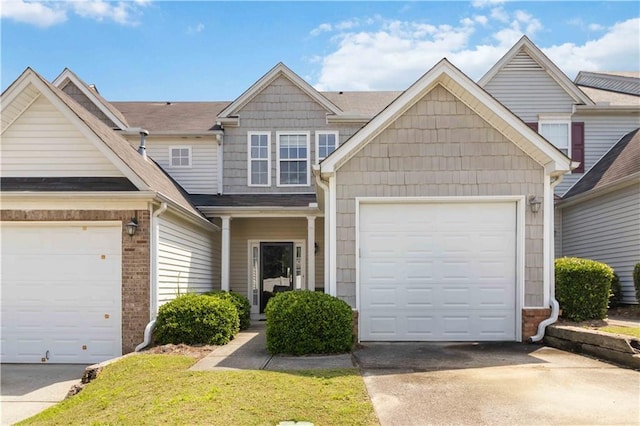 5351 Paramount View Way, Sugar Hill, GA 30518 - townhome / multi-family property featuring driveway, an attached garage, and brick siding
