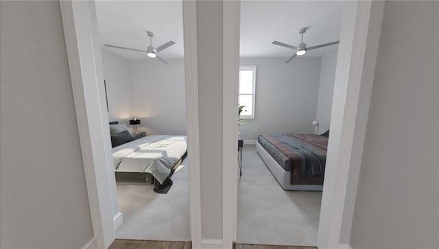 bedroom with light hardwood / wood-style floors and ceiling fan