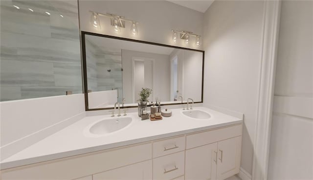 bathroom featuring vanity and an enclosed shower