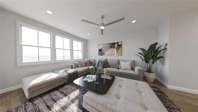 living room featuring ceiling fan and wood-type flooring