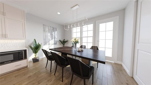 dining space featuring light hardwood / wood-style flooring