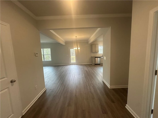 unfurnished dining area with crown molding, baseboards, dark wood finished floors, and an inviting chandelier