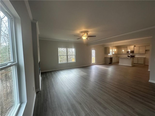 unfurnished living room featuring crown molding, baseboards, ceiling fan, and dark wood-style floors