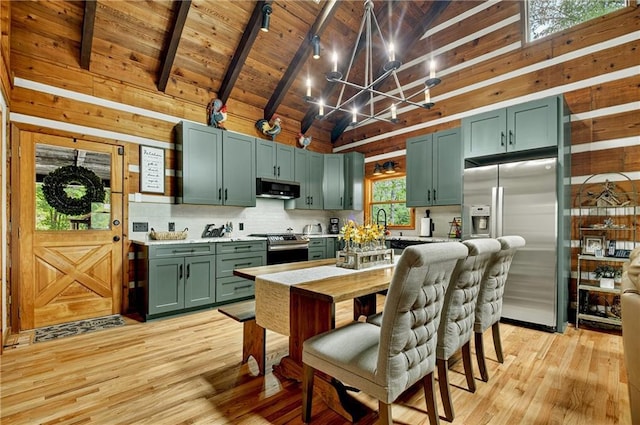 212 Dogpatch Ln, Blue Ridge, GA 30513 - kitchen featuring stainless steel appliances, exhaust hood, green cabinets, a chandelier, and light wood-style floors