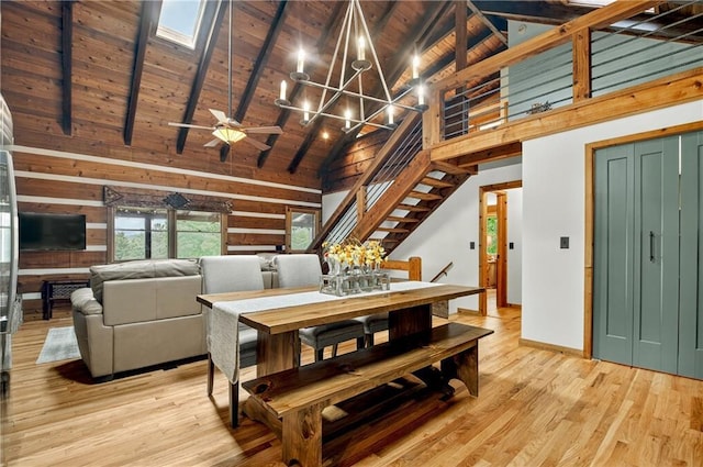 212 Dogpatch Ln, Blue Ridge, GA 30513 - dining space featuring a chandelier, high vaulted ceiling, wood ceiling with exposed beams, light wood-style flooring, and baseboards