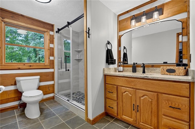 212 Dogpatch Ln, Blue Ridge, GA 30513 - full bathroom with toilet, vanity, a stall shower, baseboards, and tile patterned floors