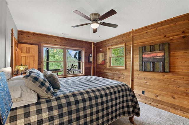 212 Dogpatch Ln, Blue Ridge, GA 30513 - bedroom featuring carpet flooring, multiple windows, wooden walls, and a ceiling fan