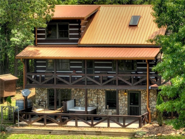 212 Dogpatch Ln, Blue Ridge, GA 30513 - back of property featuring stone siding, metal roof, and log exterior