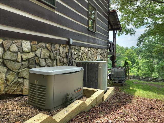 212 Dogpatch Ln, Blue Ridge, GA 30513 - exterior view of stone siding, a power unit, and cooling unit