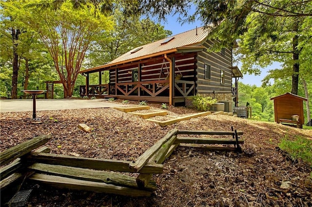 212 Dogpatch Ln, Blue Ridge, GA 30513 - view of property exterior featuring metal roof and central AC unit