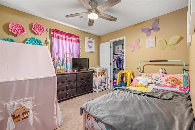 carpeted bedroom featuring a closet and ceiling fan