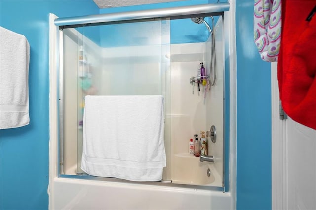 full bath with bath / shower combo with glass door