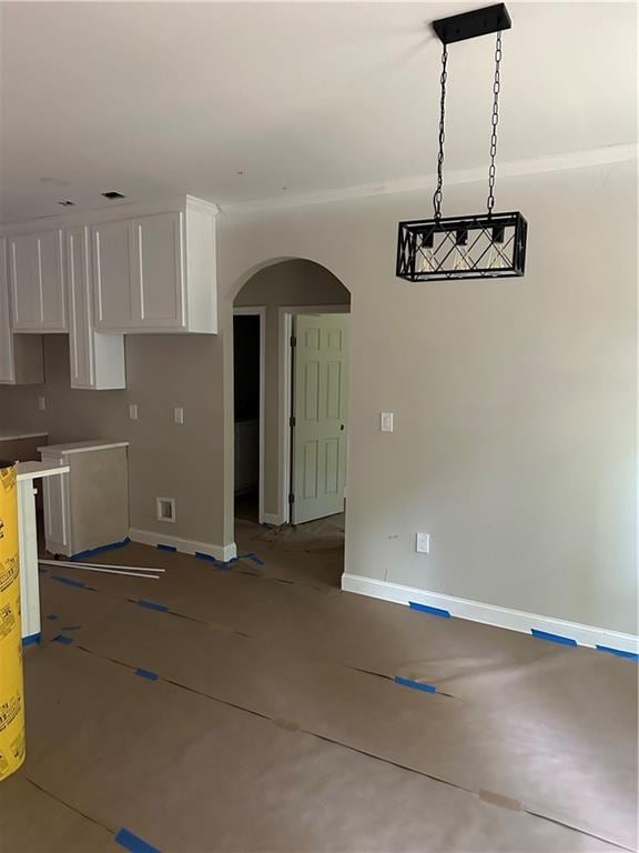 unfurnished dining area with concrete floors