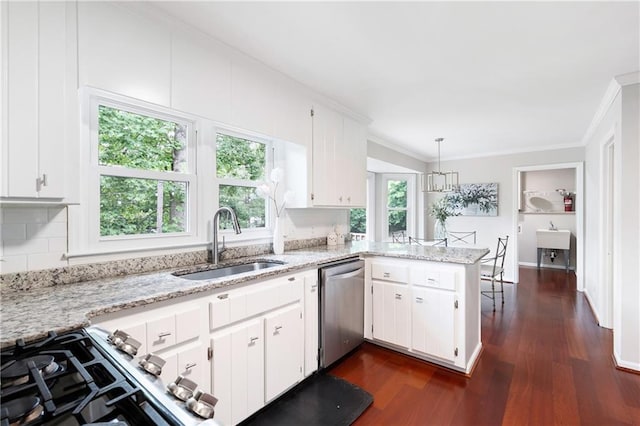 4497 Windsor Oaks Dr, Marietta, GA 30066 - kitchen featuring dishwasher, ornamental molding, dark wood finished floors, white cabinetry, and a peninsula