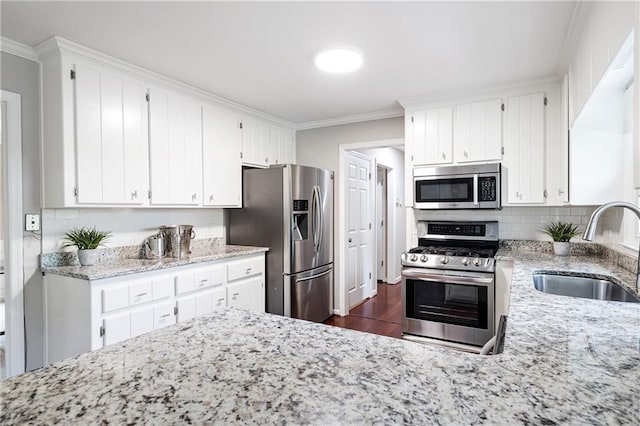 4497 Windsor Oaks Dr, Marietta, GA 30066 - kitchen with stainless steel appliances, crown molding, dark wood-style floors, backsplash, and light stone counters