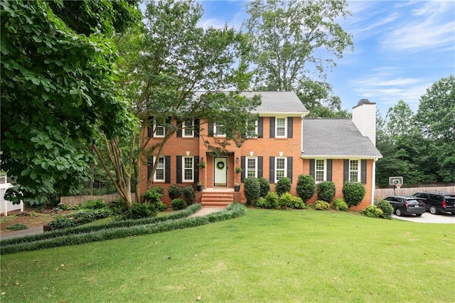 4497 Windsor Oaks Dr, Marietta, GA 30066 - colonial house with a chimney and brick siding