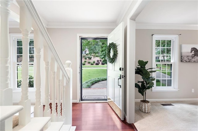 4497 Windsor Oaks Dr, Marietta, GA 30066 - foyer entrance with healthy amount of natural light, ornamental molding, stairs, and wood finished floors