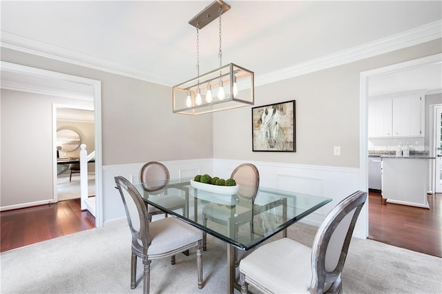 4497 Windsor Oaks Dr, Marietta, GA 30066 - dining room with wainscoting, crown molding, and wood finished floors