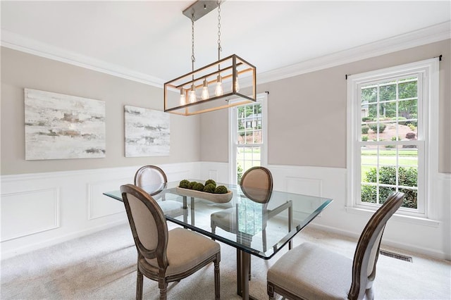 4497 Windsor Oaks Dr, Marietta, GA 30066 - dining area featuring a chandelier, crown molding, carpet floors, wainscoting, and a decorative wall