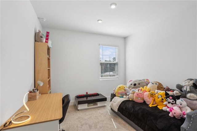 bedroom featuring light carpet