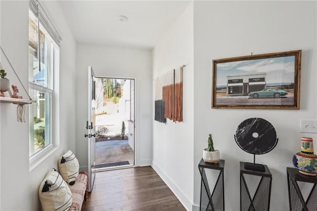 interior space with dark wood-style floors and baseboards