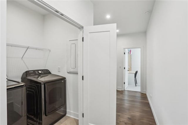 laundry room with recessed lighting, baseboards, separate washer and dryer, and wood finished floors