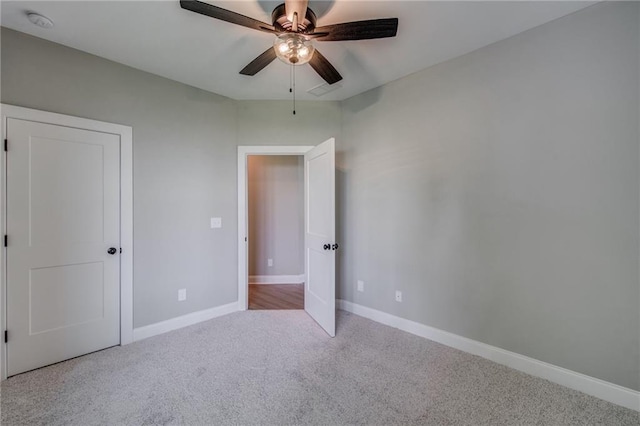 unfurnished bedroom with ceiling fan and light carpet