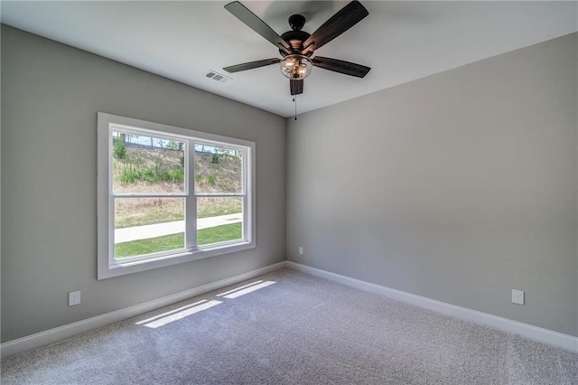 unfurnished room featuring carpet and ceiling fan