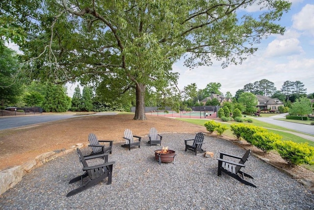 surrounding community with a fire pit